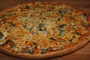 cheese pizza with fresh spinach